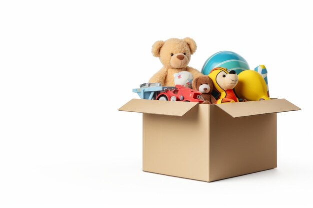 Cardboard box with toys and teddy white background