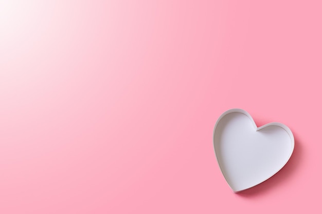 Фото Картонная коробка без крышки в форме сердца вид сверху на розовом фоне место для приглашения или текста