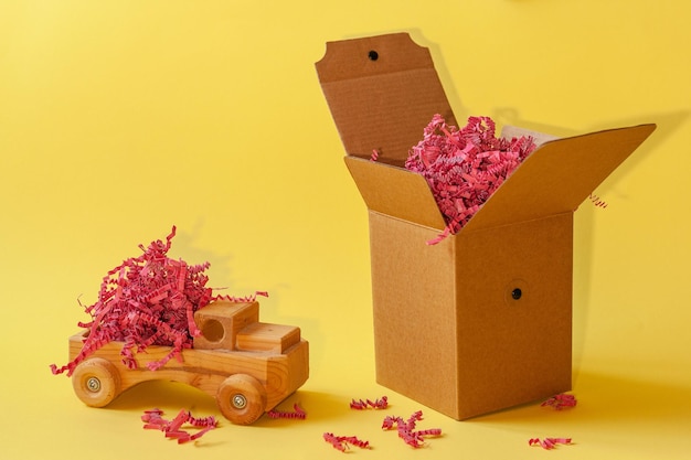 cardboard box on a yellow background for gift wrapping