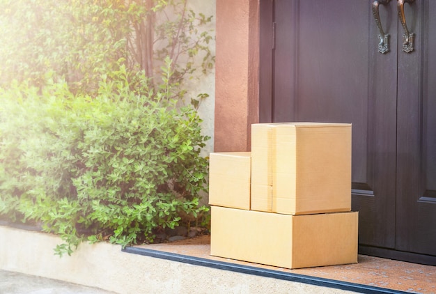 Cardboard boxes on the doorstep home delivery