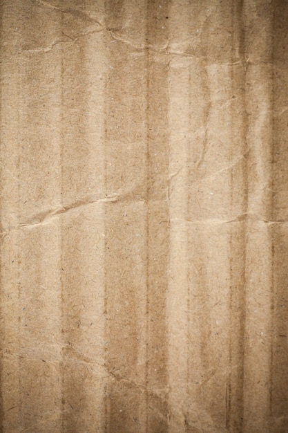 Cardboard brown paper background vignette.