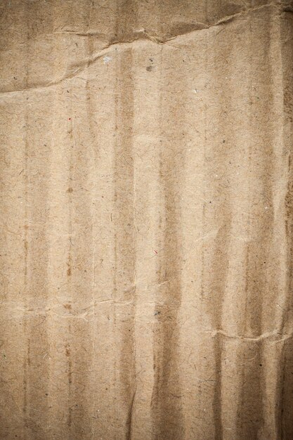 Cardboard brown paper background vignette.