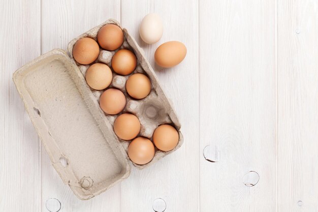 Cardboard egg box on wooden table