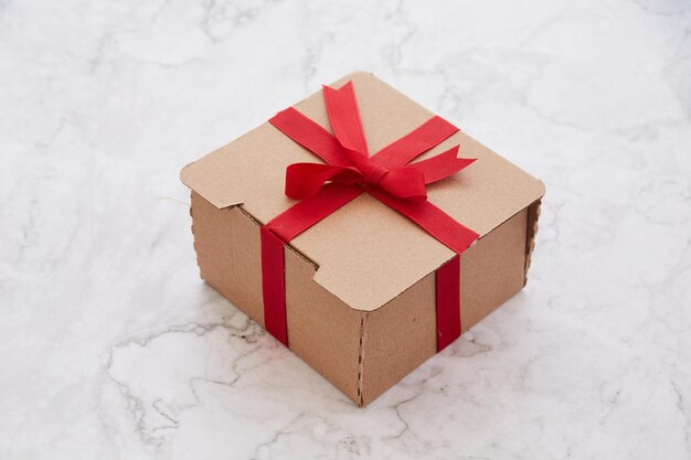 Cardboard gift box on a marble background