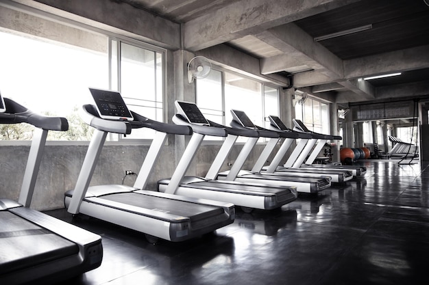 Cardio machine in gym with modern fitness equipment for fitness events and more. Modern of gym interior with equipment. Sports equipment in the gym.