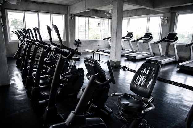 Cardio machine in gym with modern fitness equipment for fitness events and more. Modern of gym interior with equipment. Sports equipment in the gym.