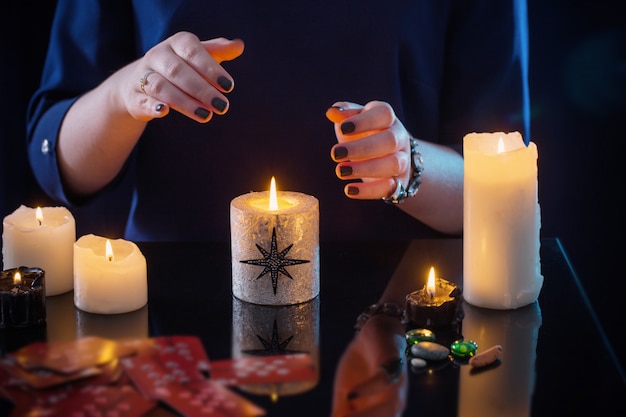 Cards and candles on a reflective table