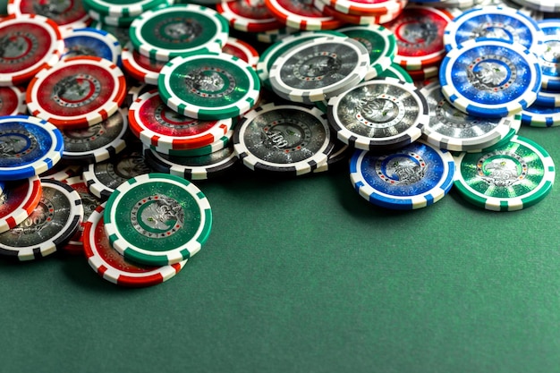 Cards and chips for poker on green table