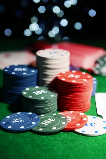 Cards and chips for poker on shiny background