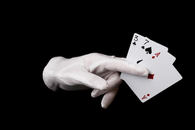 Cards in hand isolated on black