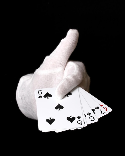 Cards in hand isolated on black