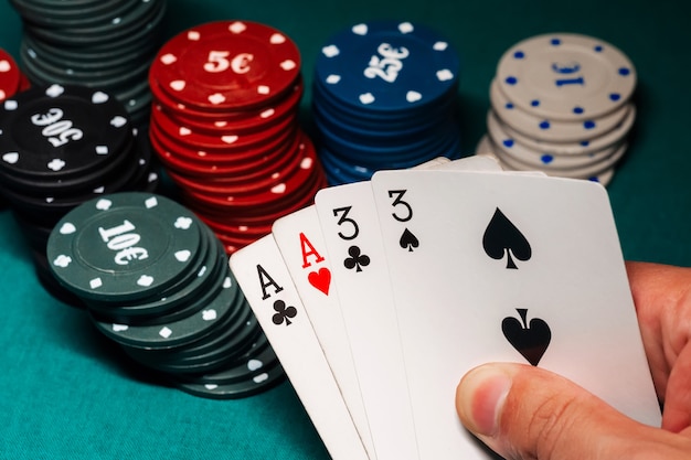 Cards with two pairs in poker in the hands of a gambler