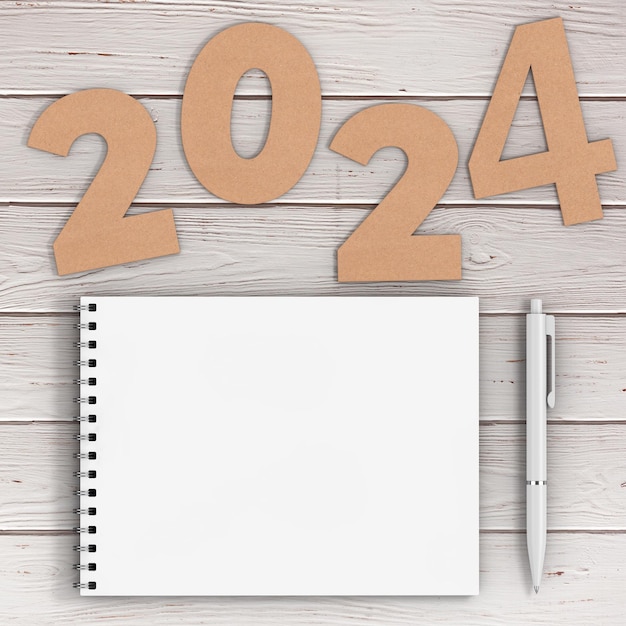 Foto cardstock nummers 2024 gelukkig nieuwjaar teken in de buurt van witte spiraal papier cover notebook met pen over houten tafel achtergrond 3d-rendering
