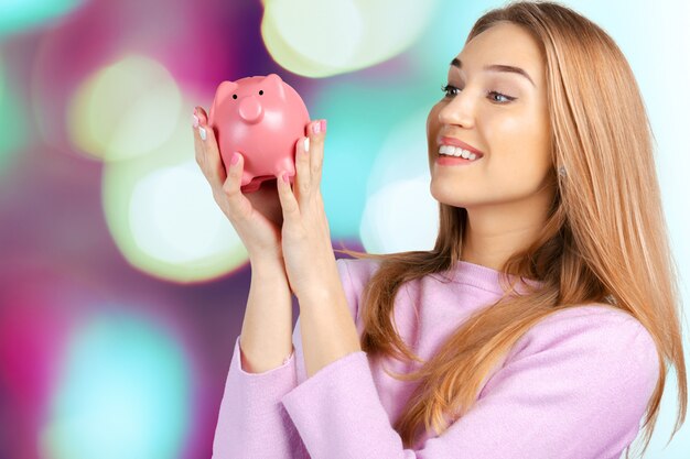 Care for Savings - Woman with a Piggy Bank