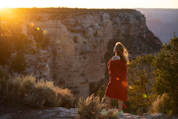 Carefree freedom concept woman in grand canyon national park life winner woman at cliff successful f...