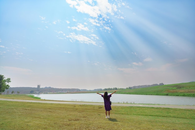 Carefree happy woman in morning of nature cliff mountain Woman travel tourist alone morning freedom and happiness