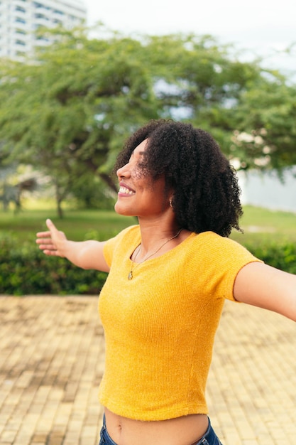 Carefree woman with arms outstretched