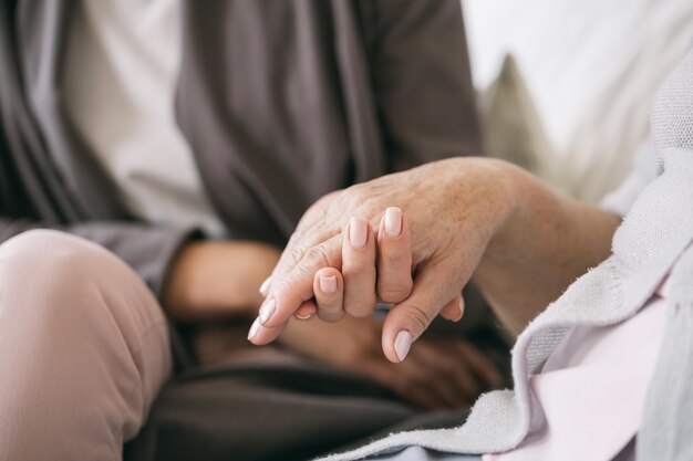 Caregiver holding the hand