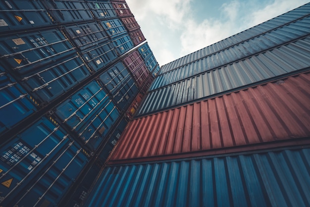 Cargo container for overseas shipping on high stack look up from ground