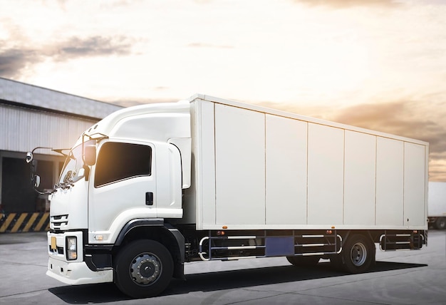 Cargo container trucks parking at the warehouse warehouse\
shipping lorry truck transport logistics