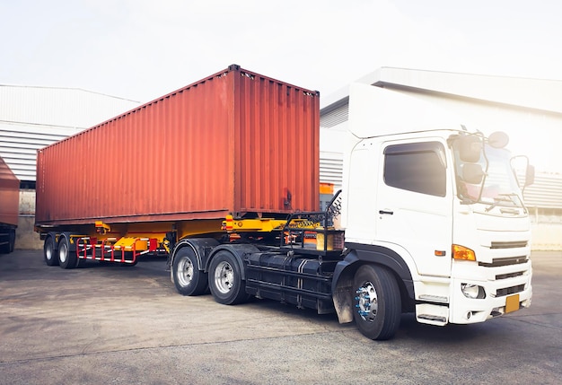 Cargo container trucks parking at the warehouse warehouse\
shipping lorry truck transport logistics