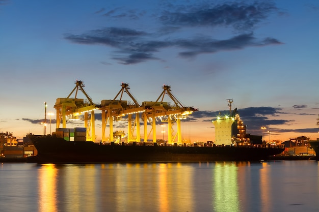 Cargo ship in the harbor at sunrise.