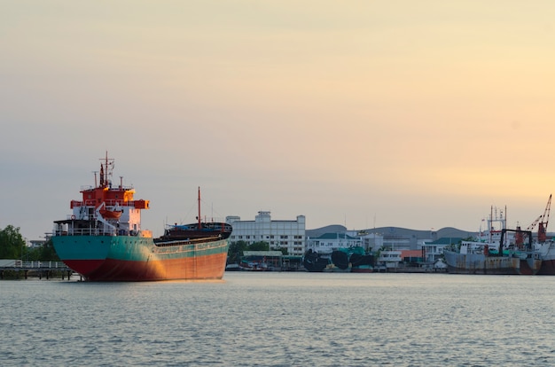 Cargo ship in the harbor at sunset, Thailand