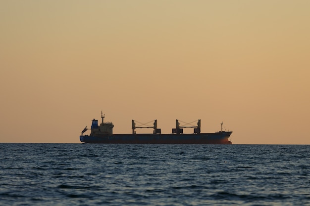 Cargo ship sails on the sea. High quality photo