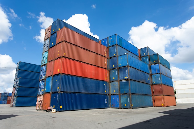 Photo cargo shipping container box in logistic shipping yard.