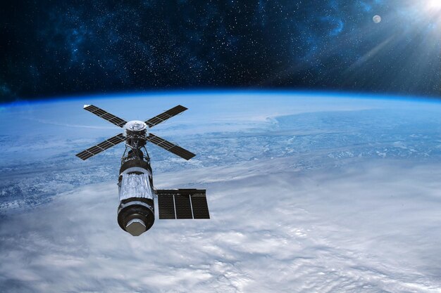 Cargo space craft earth planet.dark background. sci-fi\
wallpaper.space station orbiting earth.space ship.space art\
wallpaper.solar observatory.elements of this image furnished by\
nasa.3d illustration