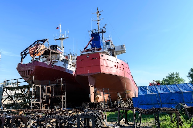 Cargo vessel ashore on ship repairing yard