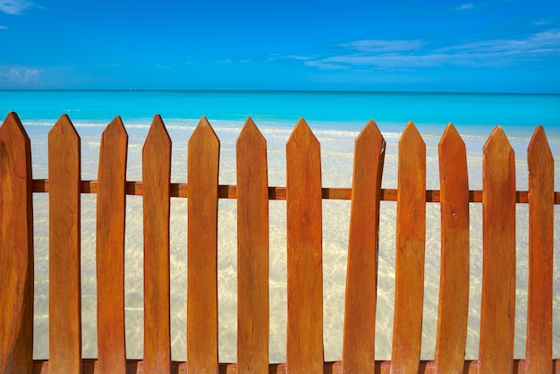 Caribbean island fence in turquoise beach