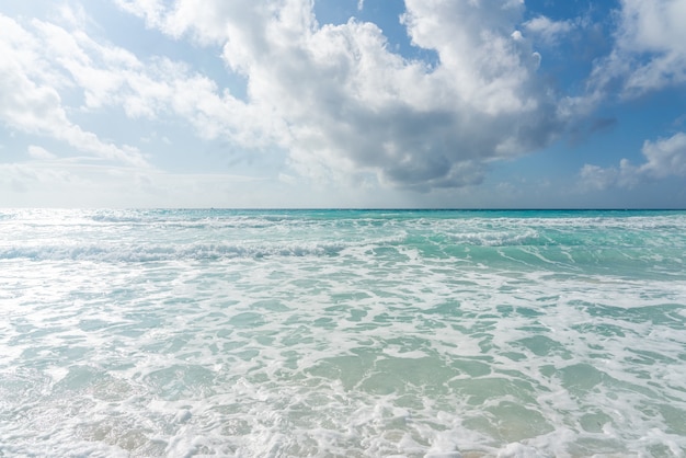 Caribbean sea horizon and blue sky with clouds summer beach background panoramic view of turquoise