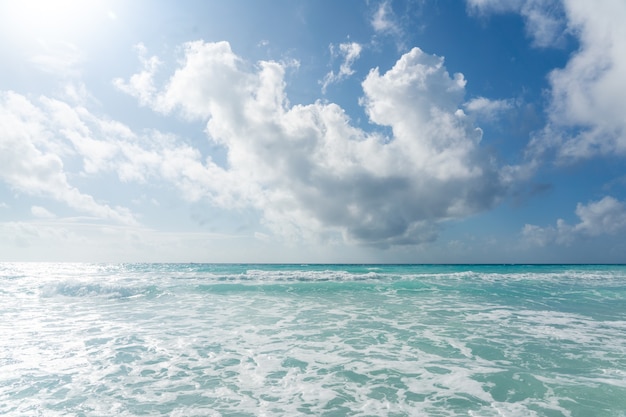 Caribbean sea horizon and blue sky with clouds summer beach background panoramic view of turquoise