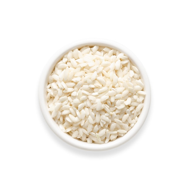 Carnaroli rice in a white bowl on white background Square format Top view