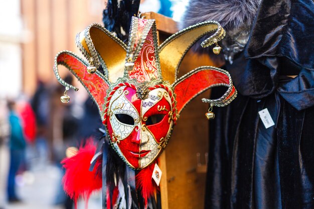 A carnival mask hanging at the market