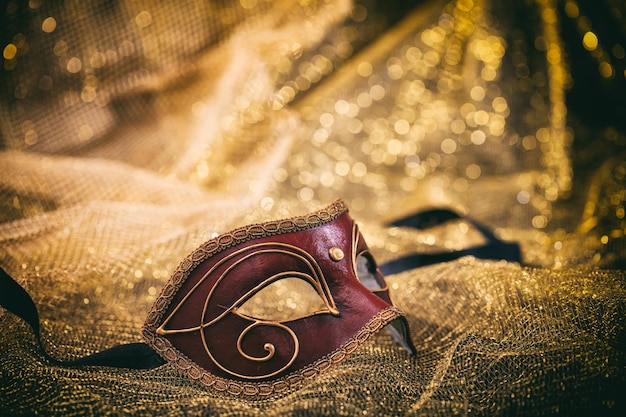 Carnival mask isolated on golden blur background