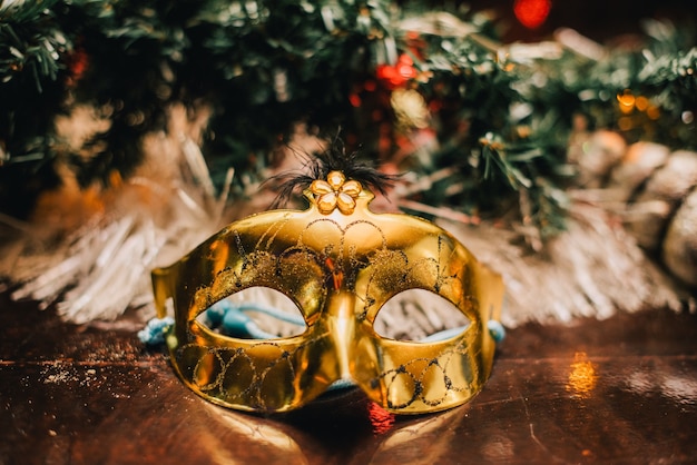 Carnival mask near the Christmas tree. mask near new year tree.