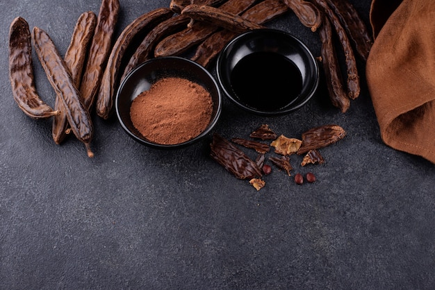 Carob pods powder and molasses or syrup