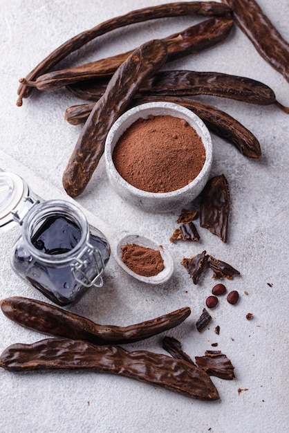 Carob pods powder and molasses or syrup