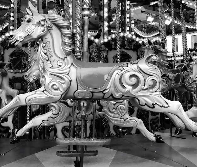 Premium Photo Carousel horse in amusement park
