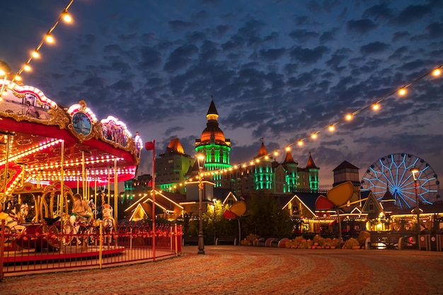 Carousel in the night autumn park