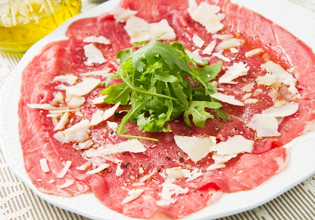 Carpaccio of beef on arugula