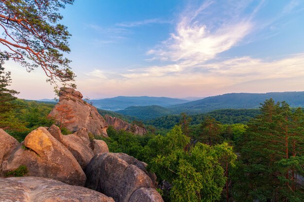 Carpathian mountains landscape at sunset, huge stone rocks of Dovbush, panoramic view.