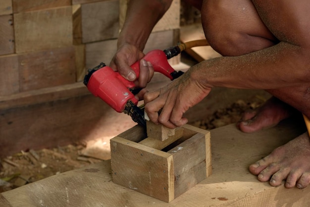 Carpenter in Burma working in his workshop