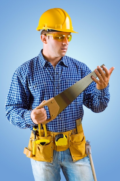 Carpenter holding handsaw