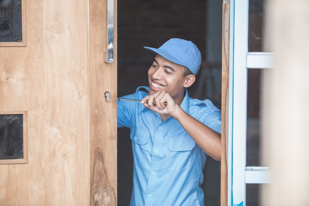 Carpenter Installing Door Lock