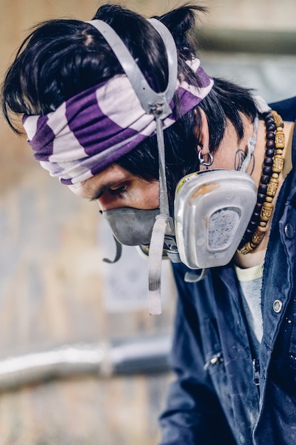 Carpenter manufacturing skateboard decks in his workshop