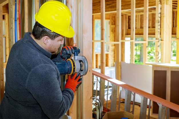 Carpenter milled with woodworking router on sawdust.