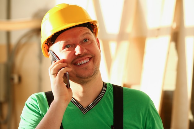 Carpenter talking on phone in hardware store